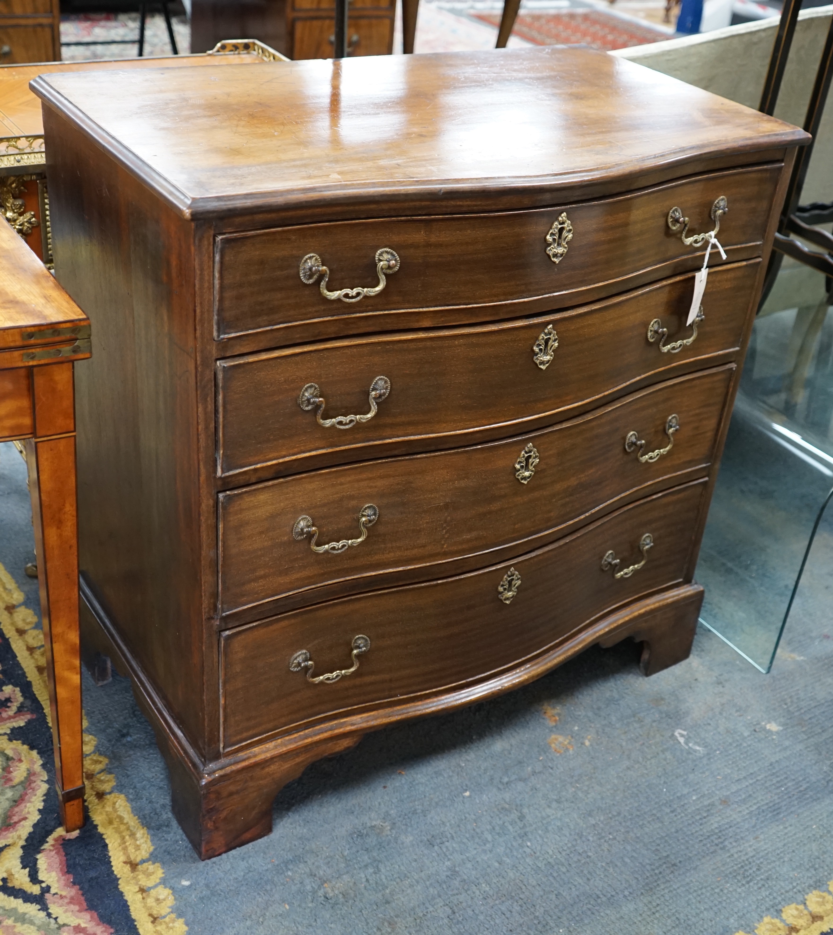 A George III mahogany four drawer serpentine chest, width 84cm, depth 49cm, height 86cm